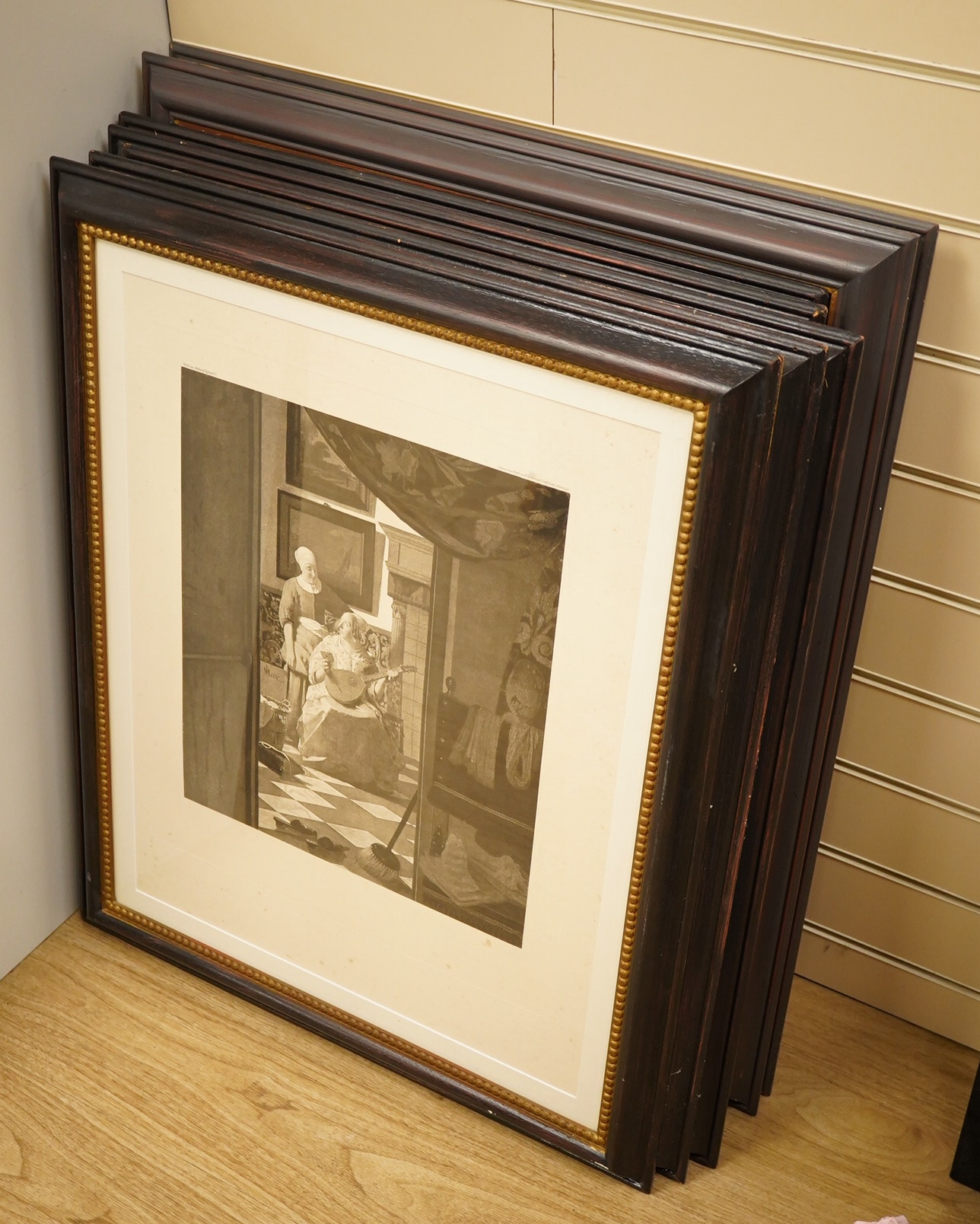 A set of eight decorative Old Master engravings to include After Vermeer, ‘The Girl with the Pearl Earring’ and ‘The Love Letter’, published Amsterdam, 60 x 47cm, housed in partially gilt frames. Condition - fair, some f